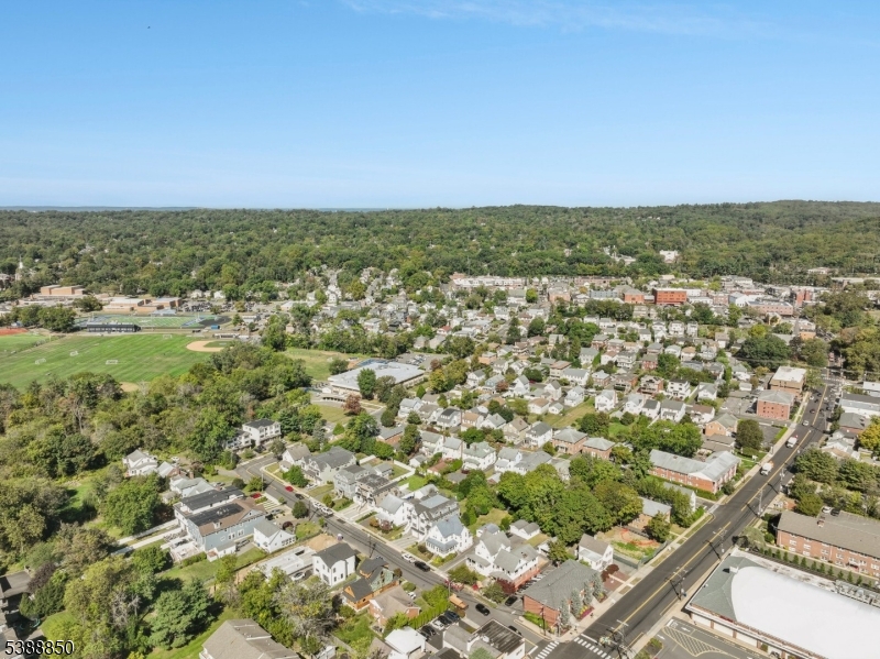 27 Willow Street, Unit A Millburn, NJ 07041 - Photo 50 of 50 an aerial view of residential houses with outdoor space and trees