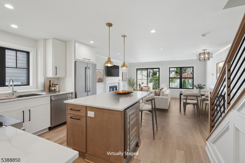 27 Willow Street, Unit A Millburn, NJ 07041 - Photo 8 of 50 a kitchen with a table chairs sink and cabinets
