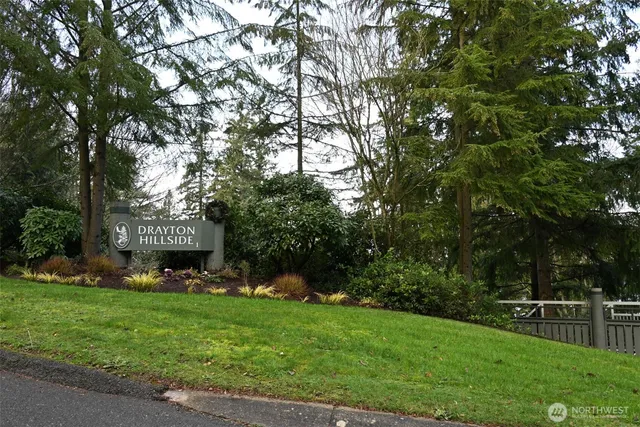 a view of an house with backyard space and balcony