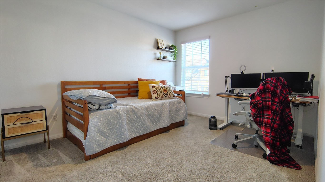 316 Turnbuckle Bend Leander, TX 78641 - Photo 13 of 21 a bedroom with bed and a window