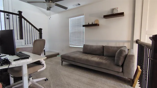 a living room with furniture and a window