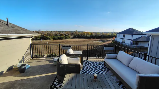a view of a roof deck with couches