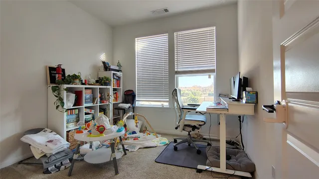 a room with furniture and a window