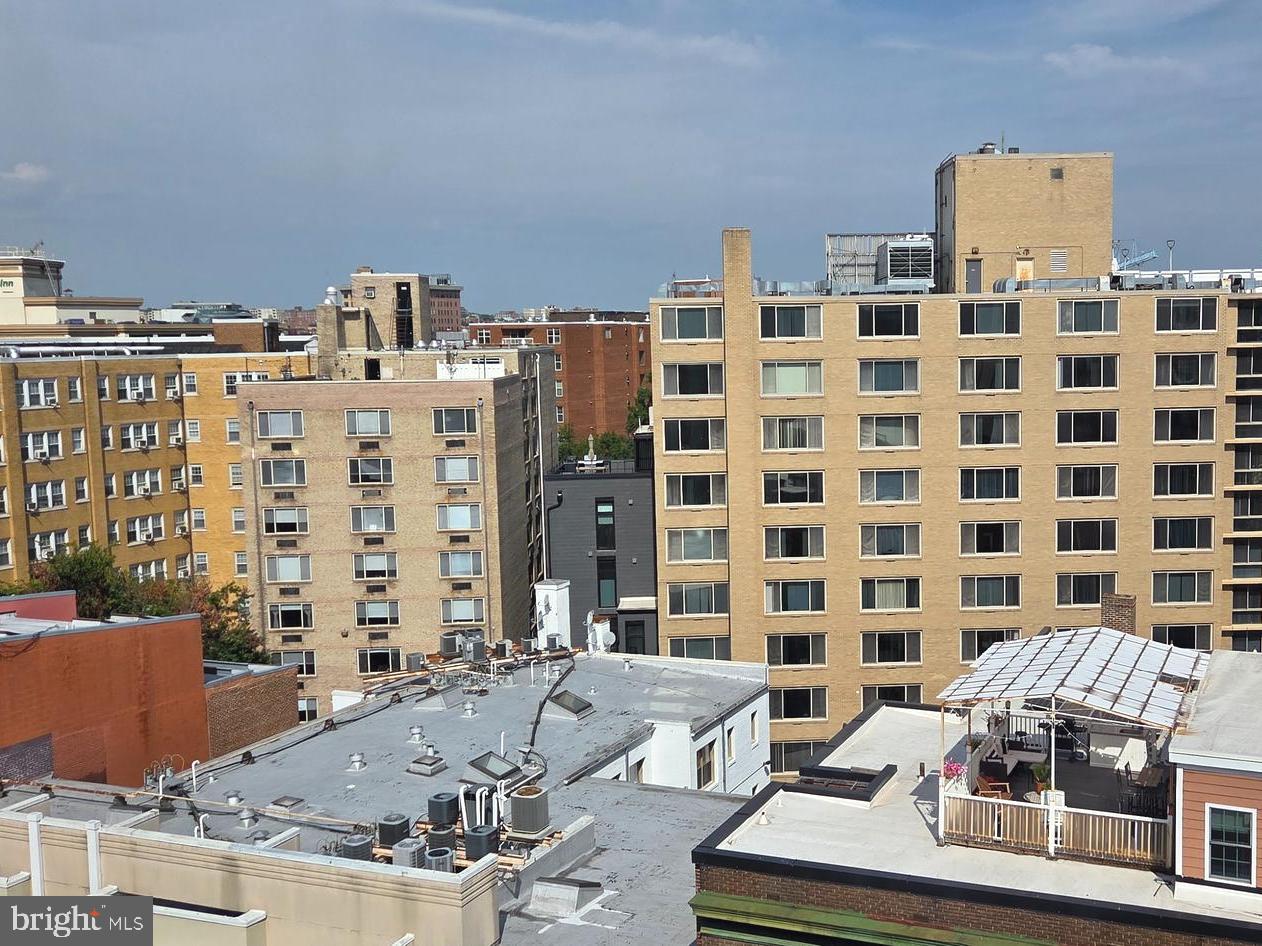 1440 N Street Northwest, Unit 1011 Washington, DC 20005 - Photo 11 of 14 a view of a building with balcony