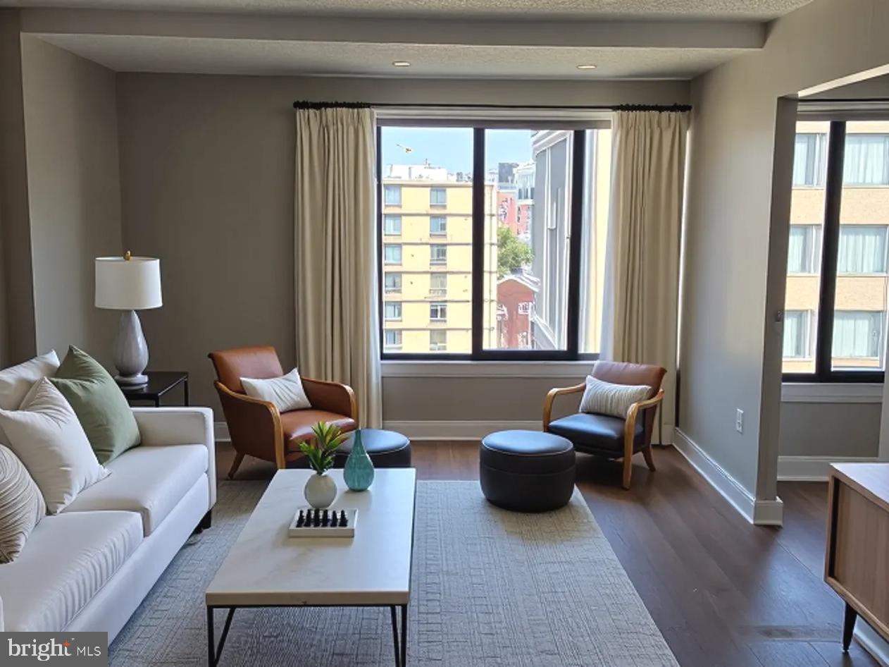 1440 N Street Northwest, Unit 1011 Washington, DC 20005 - Photo 2 of 14 a living room with furniture and a window