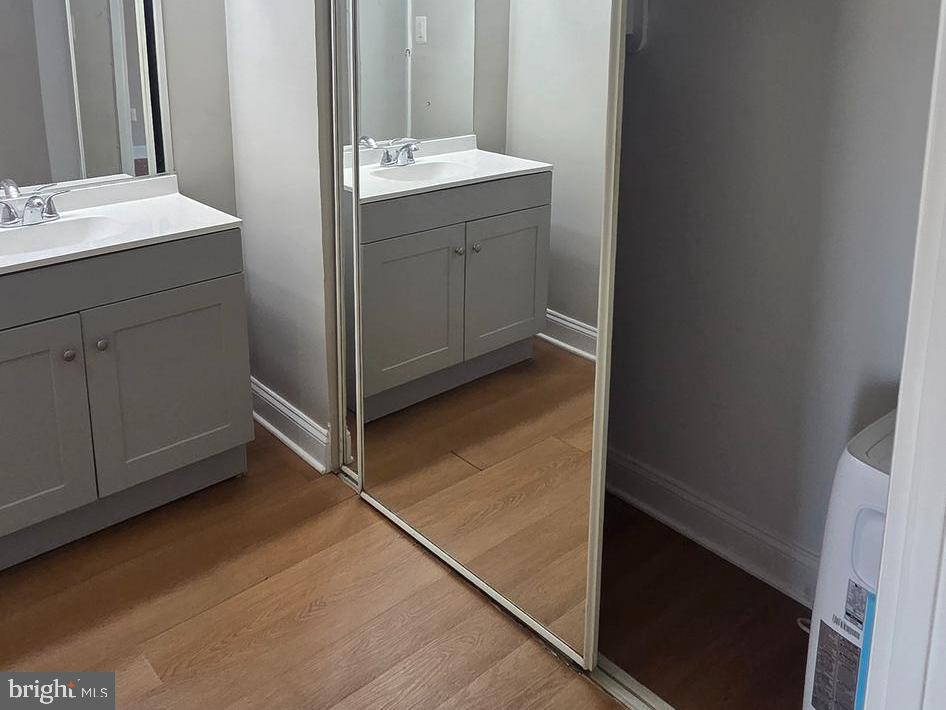 1440 N Street Northwest, Unit 1011 Washington, DC 20005 - Photo 7 of 14 a bathroom with a sink and mirror