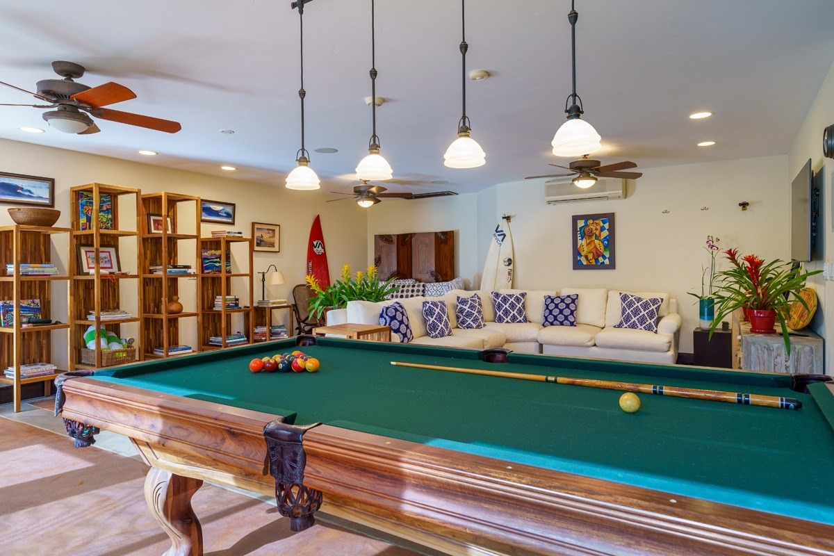 2260 Ho'ohu Road Poipu, HI 96756 - Photo 7 of 23 a room with lots of white furniture and a chandelier