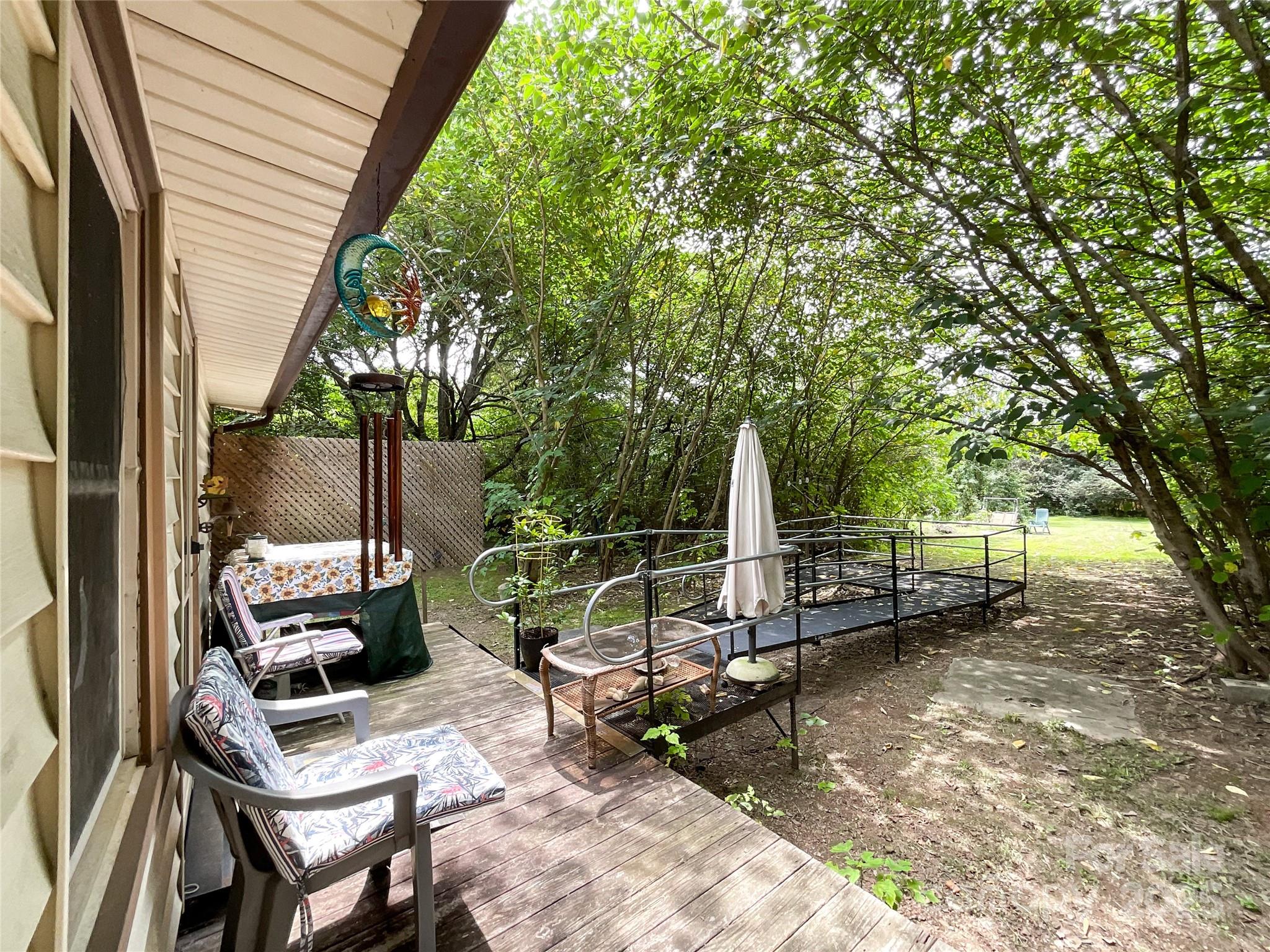 17837 Porter Hill Road Norwood, NC 28128 - Photo 12 of 37 a backyard of a house with outdoor seating