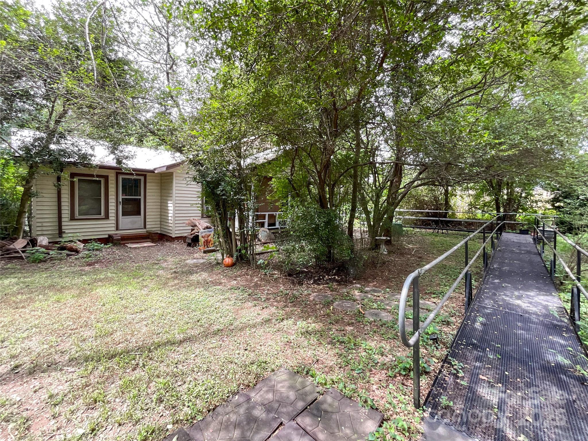 17837 Porter Hill Road Norwood, NC 28128 - Photo 13 of 37 a view of a house with backyard