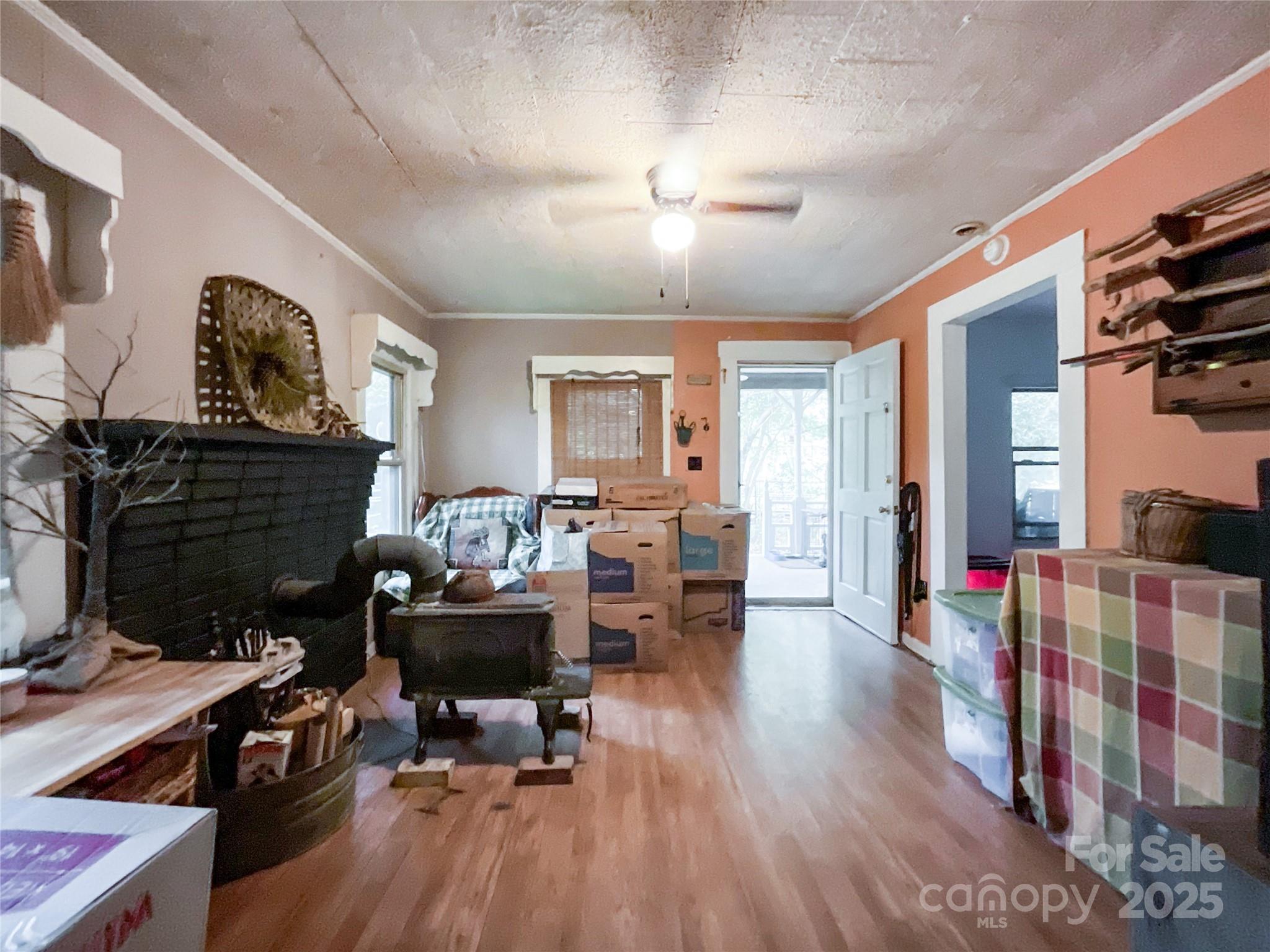 17837 Porter Hill Road Norwood, NC 28128 - Photo 27 of 37 a living room with furniture and a fireplace