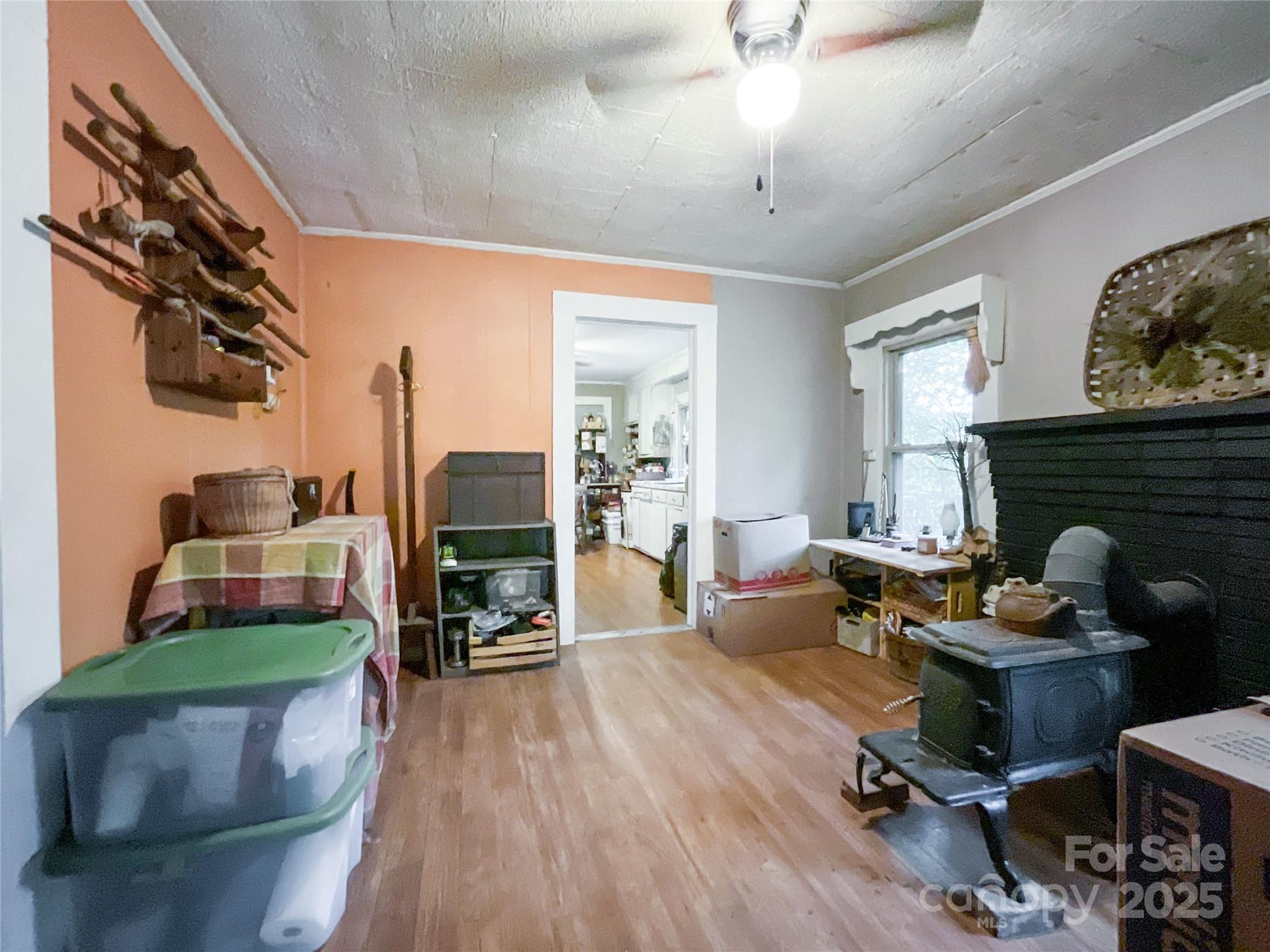 17837 Porter Hill Road Norwood, NC 28128 - Photo 29 of 37 a living room with furniture and a fireplace