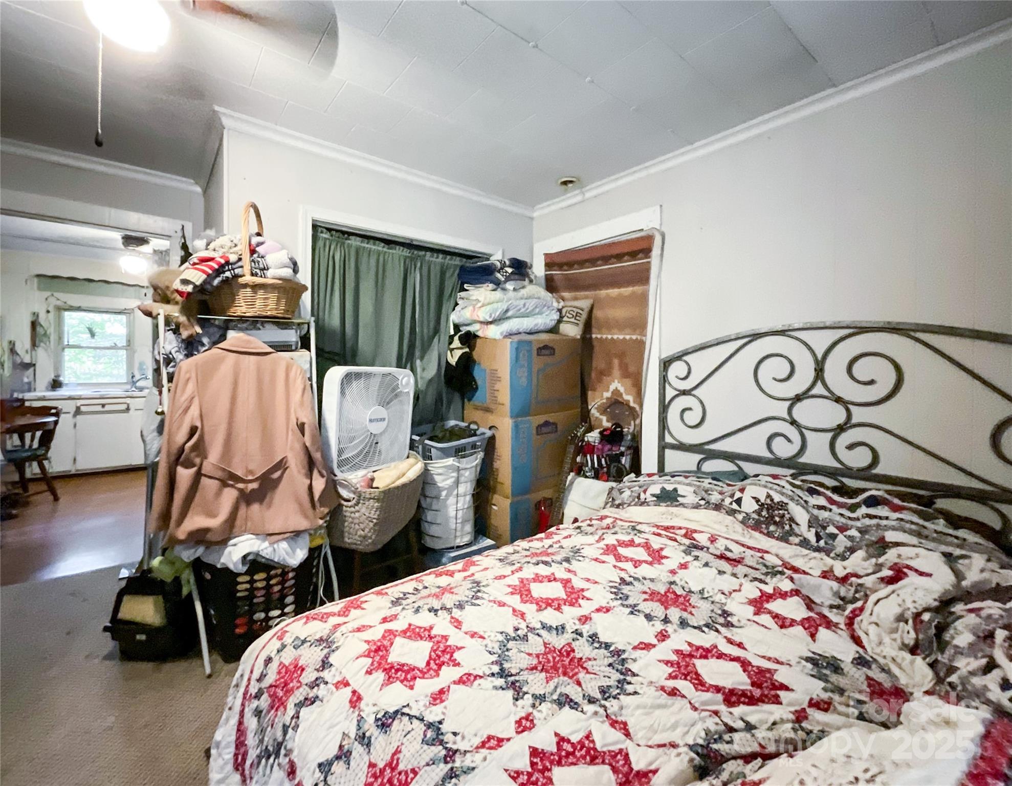 17837 Porter Hill Road Norwood, NC 28128 - Photo 30 of 37 a bedroom with bed and gym equipment