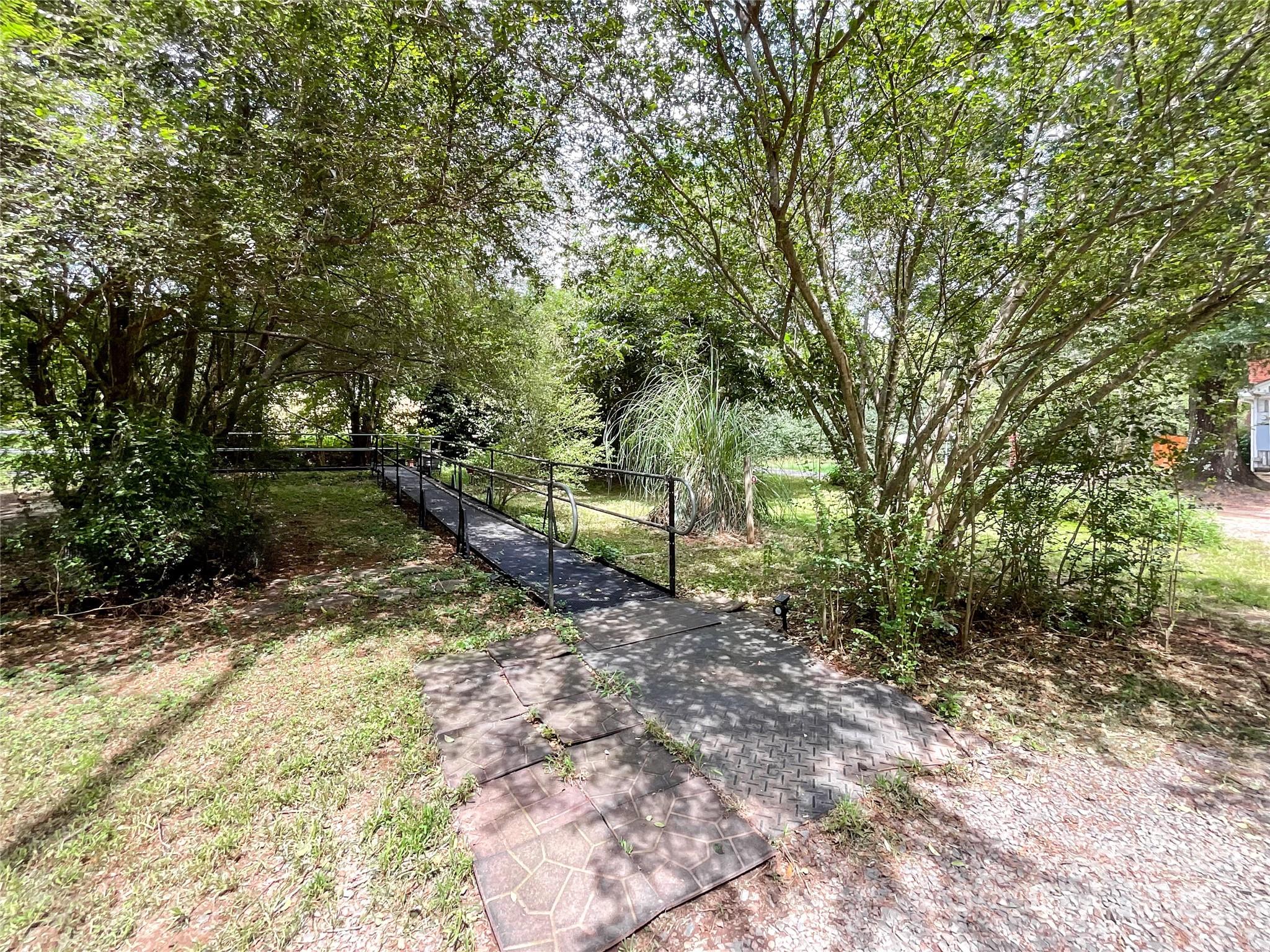 17837 Porter Hill Road Norwood, NC 28128 - Photo 3 of 37 a backyard of a house with lots of green space