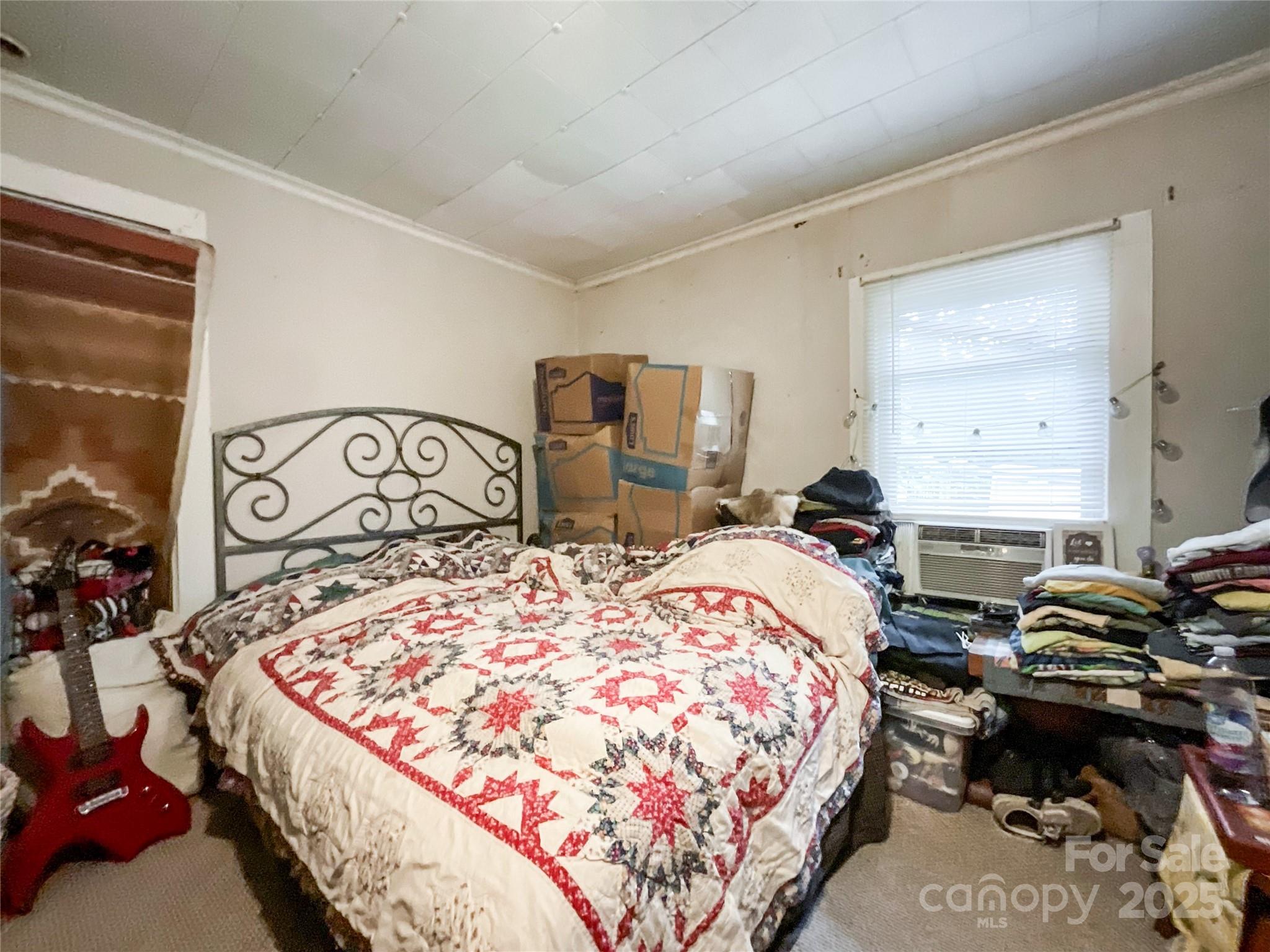 17837 Porter Hill Road Norwood, NC 28128 - Photo 31 of 37 a bedroom with bed and window
