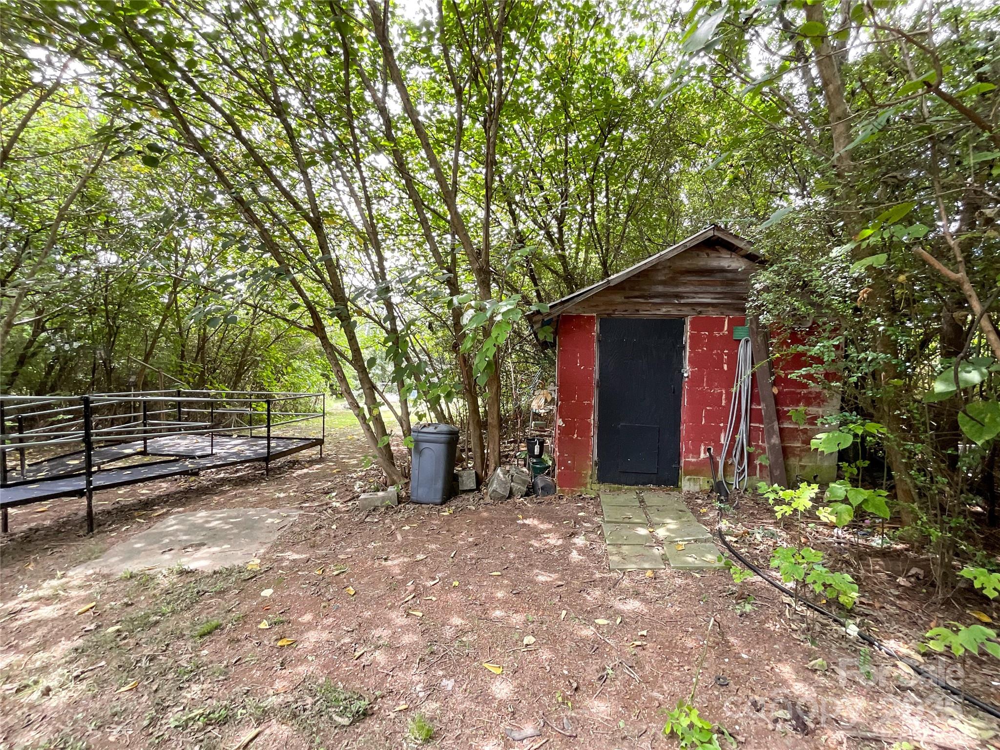 17837 Porter Hill Road Norwood, NC 28128 - Photo 10 of 37 a view of backyard with wooden fence and large trees