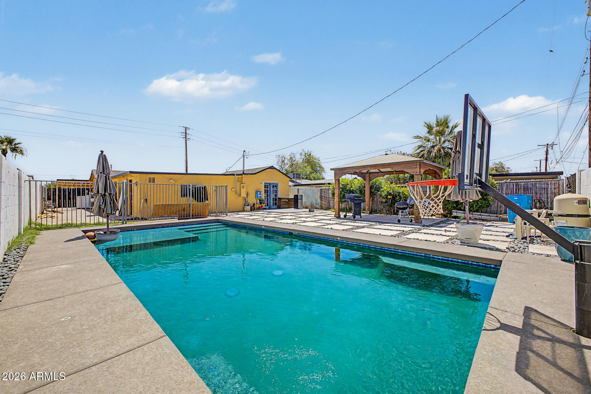 1612 South 5th Street Phoenix, AZ 85004 - Photo 22 of 27 a view of a swimming pool with a lounge chairs