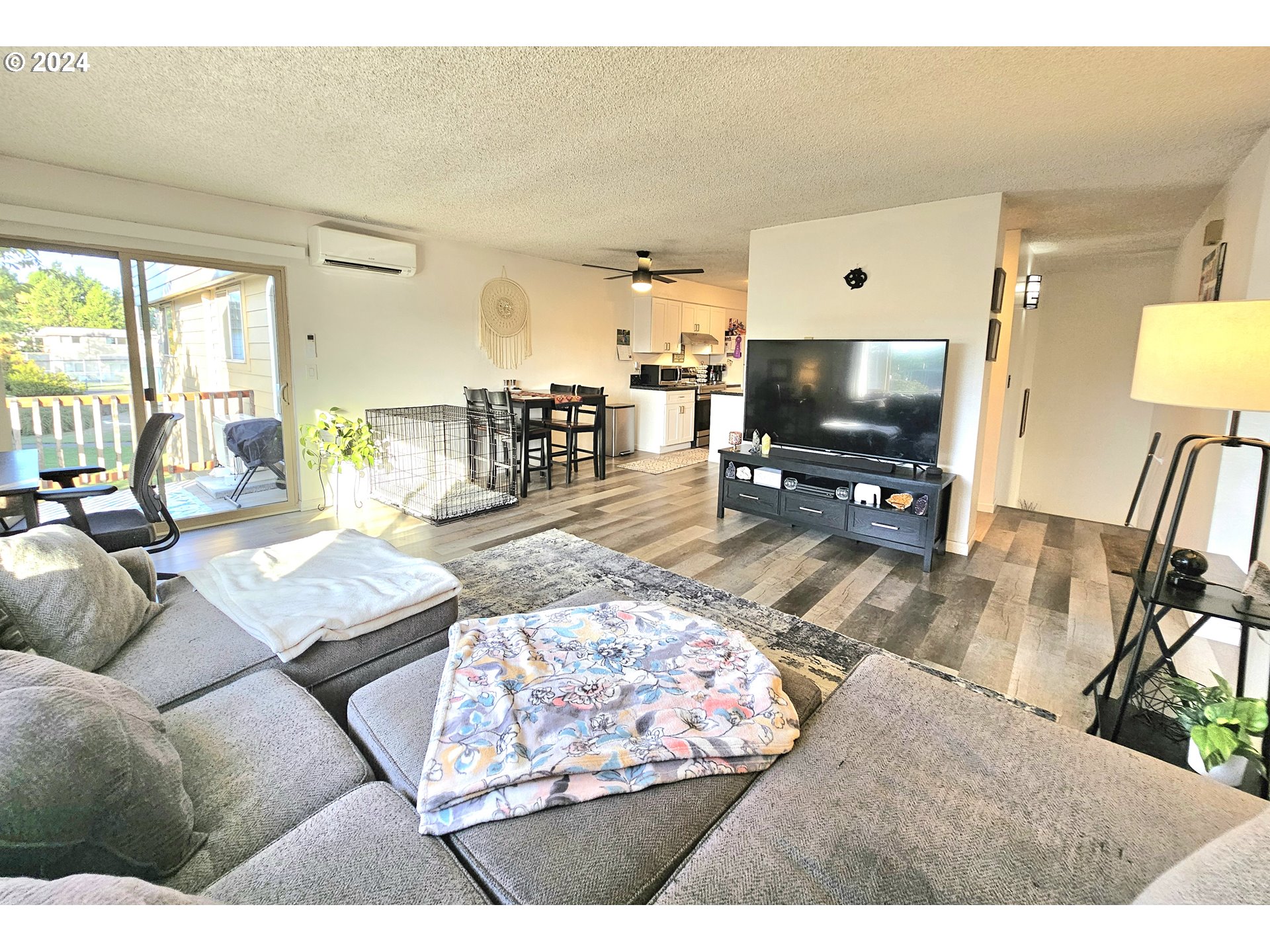 2727 Gateway Street, Unit 7 Springfield, OR 97477 - Photo 9 of 30 a living room with furniture and a flat screen tv