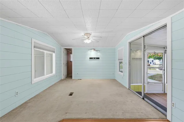 a view of an empty room with a window