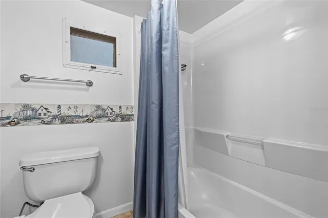 a bathroom with a toilet and a sink