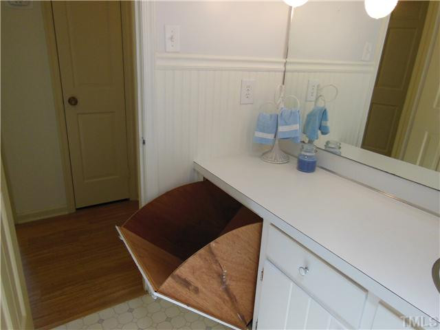 1115 Briardale Road Durham, NC 27712 - Photo 20 of 25 Cool special feature...a built -in laundry hamper in the hall bath! And notice the pretty bead board wainscotting in this bath! Bathroom