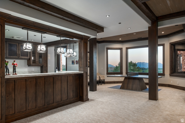 9156 Forest Road, Unit 24 Heber City, UT 84036 - Photo 28 of 42 Spacious interior featuring a built-in wet bar with dark wood cabinetry and a light-toned countertop