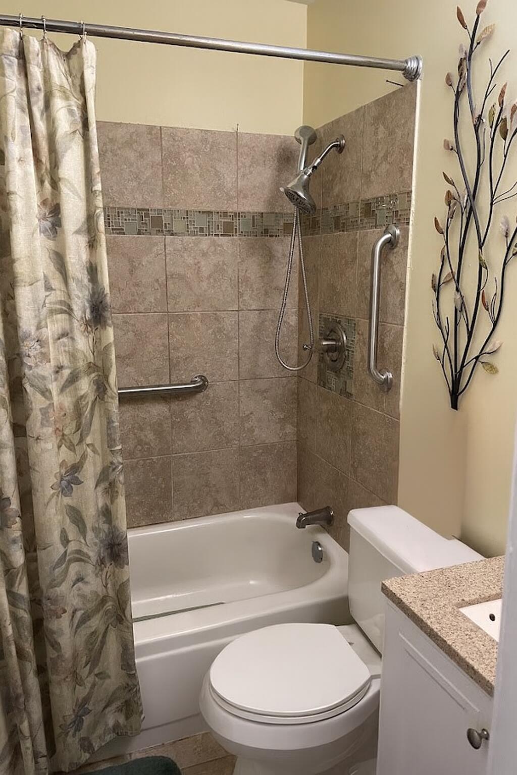 1140 Clinton Street Gary, IN 46406 - Photo 5 of 8 a bathroom with a toilet and a shower