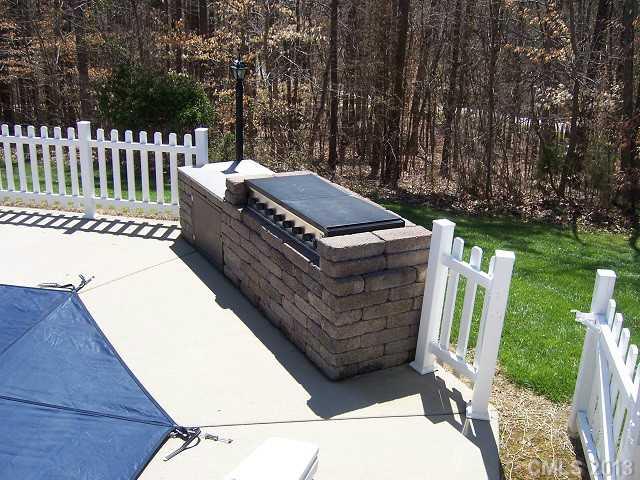 646 Mereva Road Smyrna, SC 29743 - Photo 14 of 15 a view of a chairs and table in the backyard