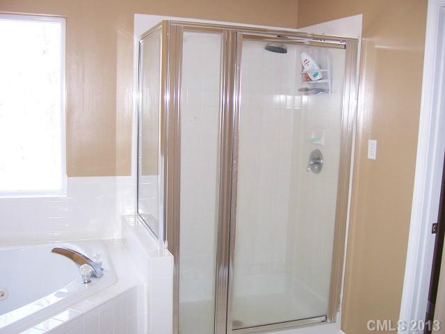 646 Mereva Road Smyrna, SC 29743 - Photo 10 of 15 a bathroom with a bathtub and a shower