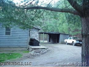 80 Creekside Loop Road Waynesville, NC 28786 - Photo 2 of 9 a couple of cars parked in front of a house