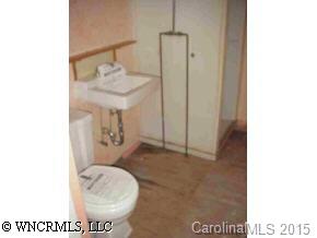80 Creekside Loop Road Waynesville, NC 28786 - Photo 9 of 9 a bathroom with a toilet and a mirror