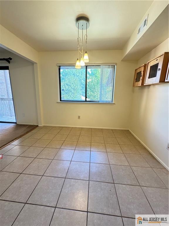 1005 Edison Glen Terrace, Unit 1005 Edison, NJ 08837 - Photo 12 of 18 a view of an empty room with a window