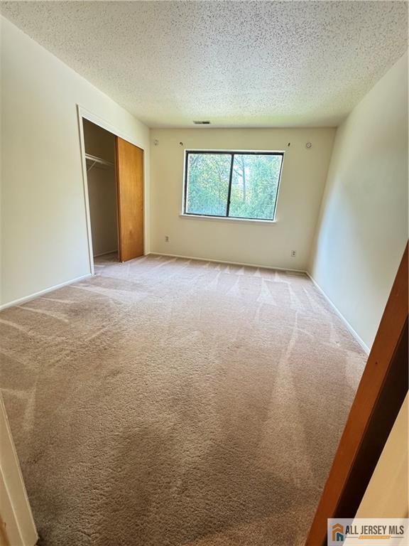 1005 Edison Glen Terrace, Unit 1005 Edison, NJ 08837 - Photo 13 of 18 an empty room with windows