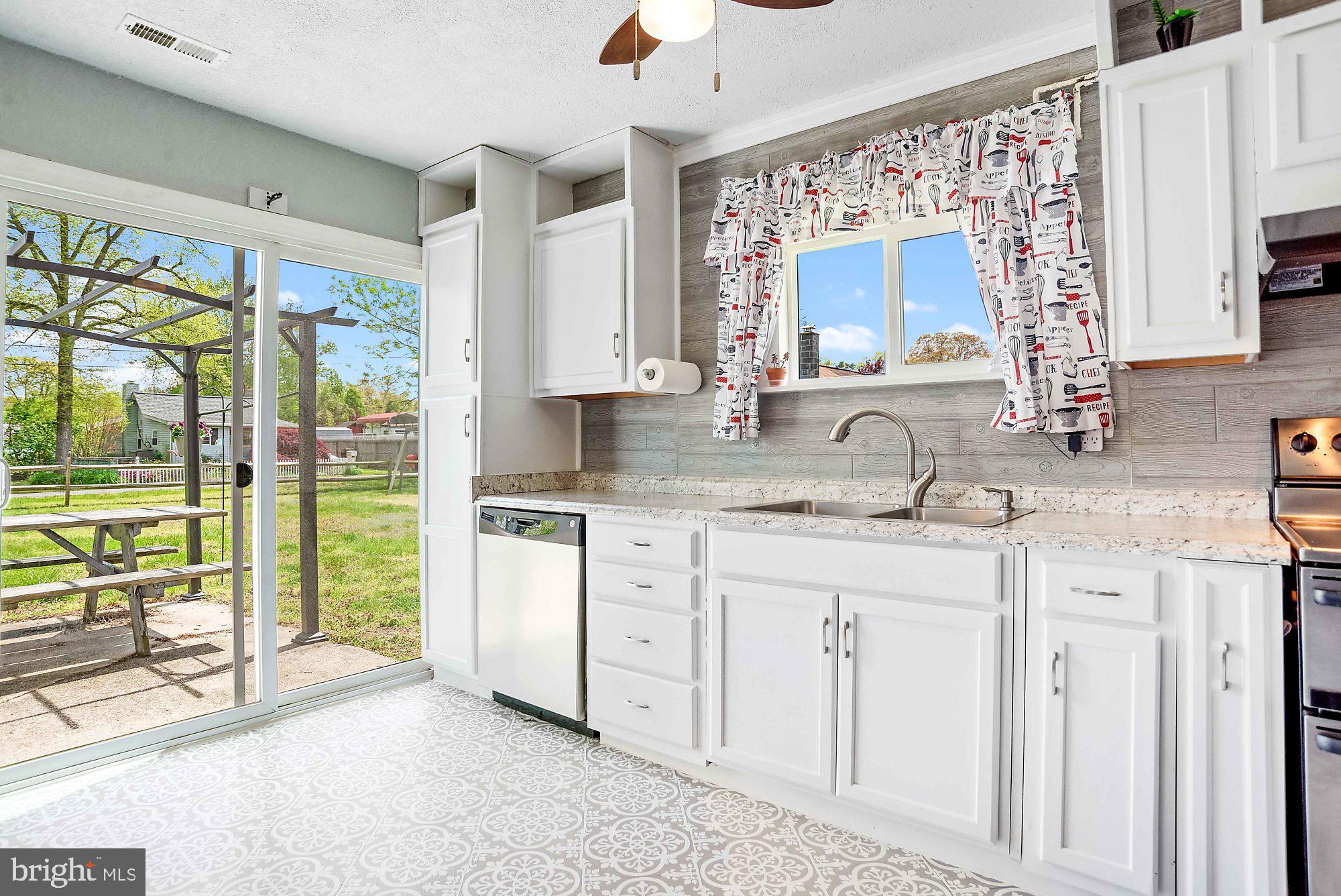 7808 Bertha Road Pasadena, MD 21122 - Photo 8 of 25 SLIDER OUT TO THE PATIO