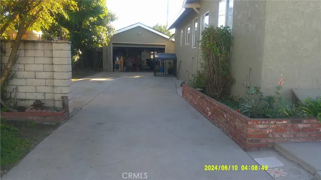 a view of a house with a street