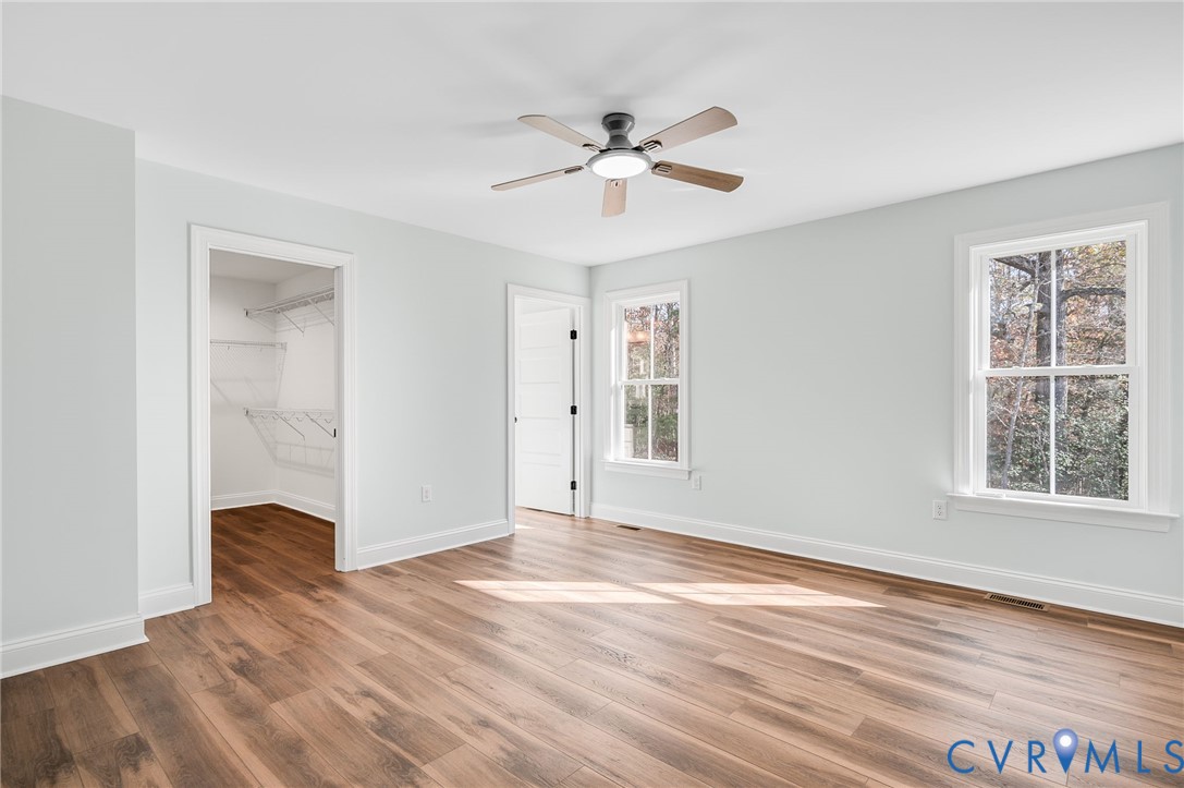 2321 Rock Island Road Scottsville, VA 24590 - Photo 15 of 24 a view of an empty room with wooden floor and a window