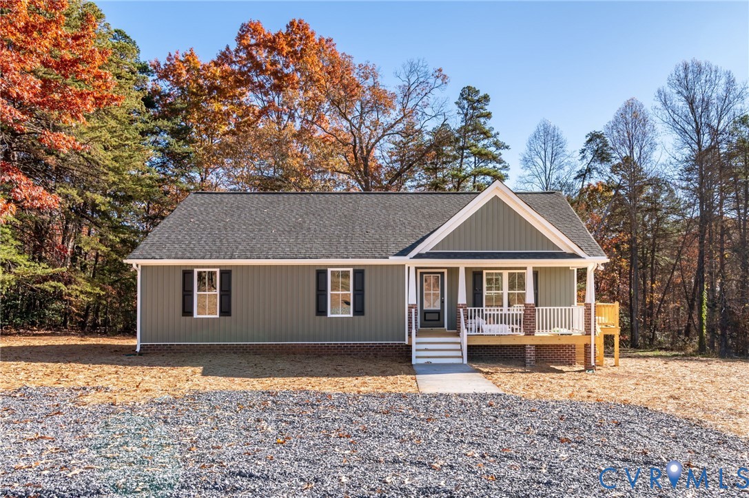 2321 Rock Island Road Scottsville, VA 24590 - Photo 2 of 24 a front view of a house with a yard covered in snow