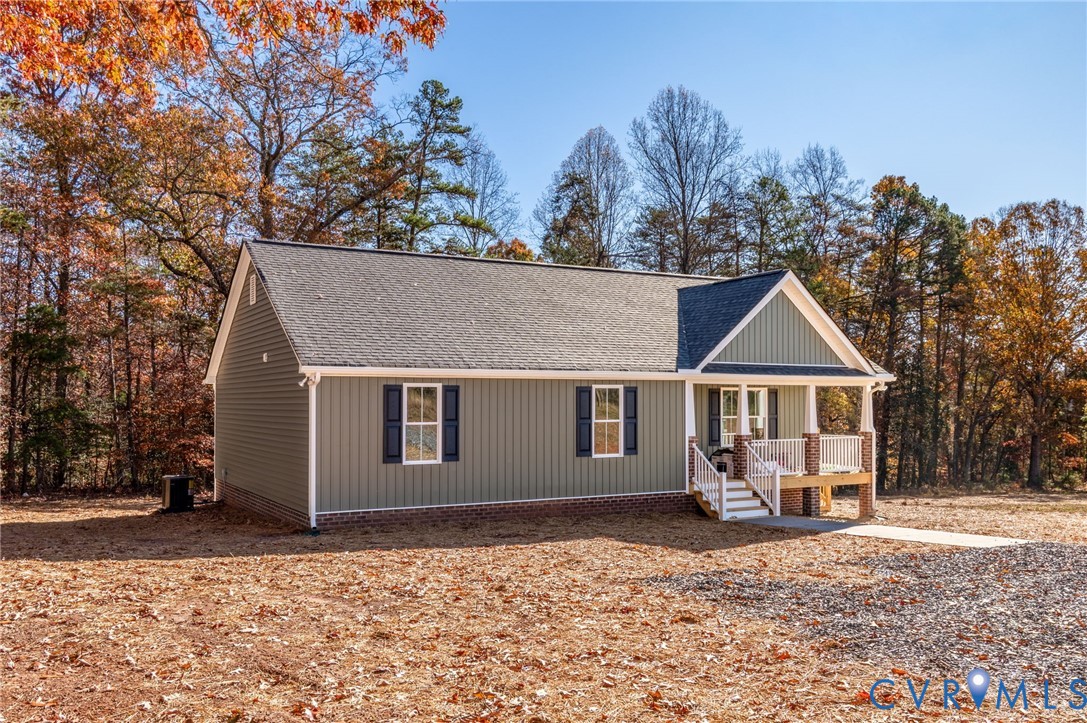 2321 Rock Island Road Scottsville, VA 24590 - Photo 3 of 24 a front view of a house with a yard and large trees