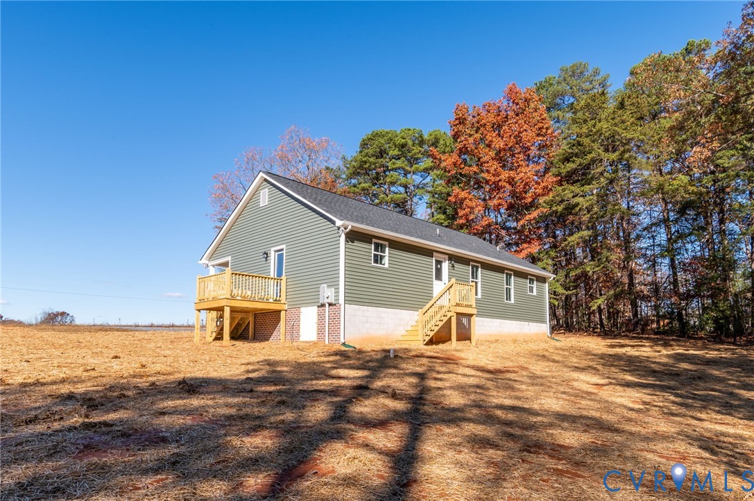 2321 Rock Island Road Scottsville, VA 24590 - Photo 4 of 24 a house with trees in the background