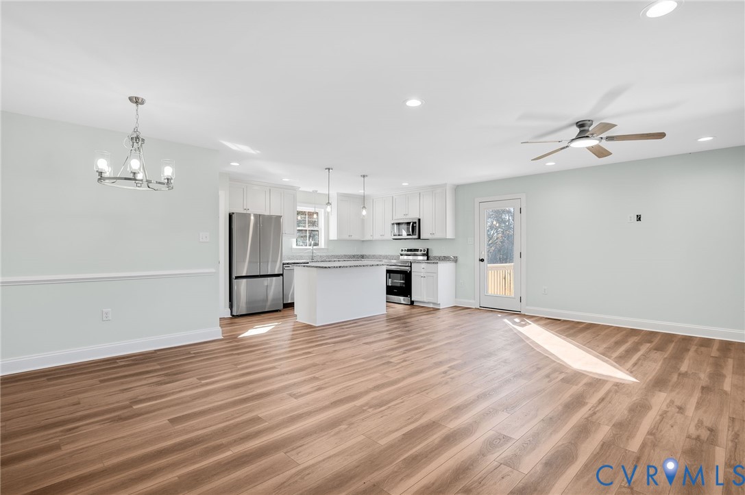 2321 Rock Island Road Scottsville, VA 24590 - Photo 5 of 24 a view of a kitchen with a sink wooden floor and a kitchen
