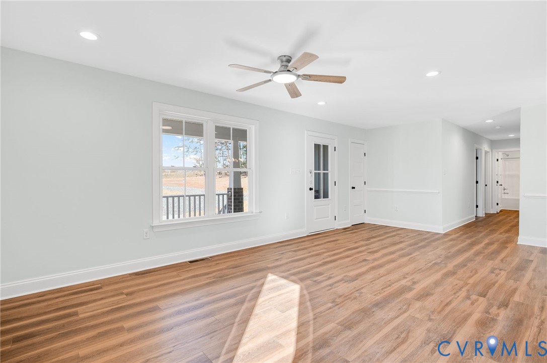 2321 Rock Island Road Scottsville, VA 24590 - Photo 8 of 24 a view of an empty room with wooden floor and a window