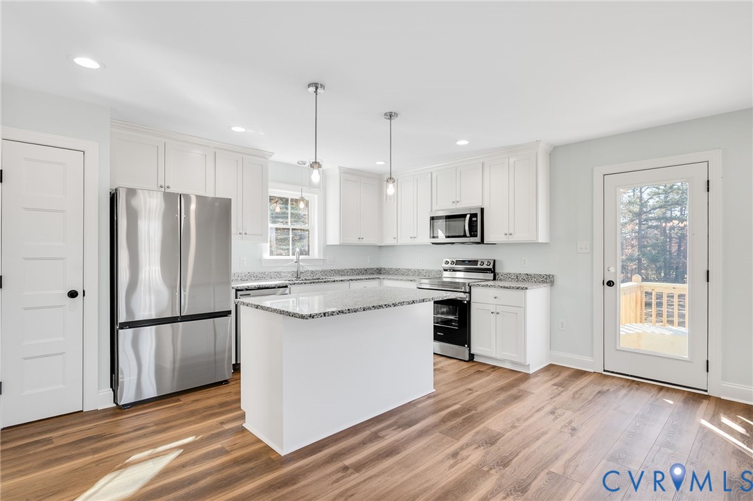 2321 Rock Island Road Scottsville, VA 24590 - Photo 10 of 24 a kitchen with stainless steel appliances granite countertop a refrigerator a stove a sink and a microwave