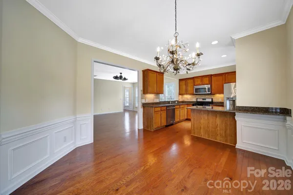 a view of a kitchen with a sink stove and refrigerator