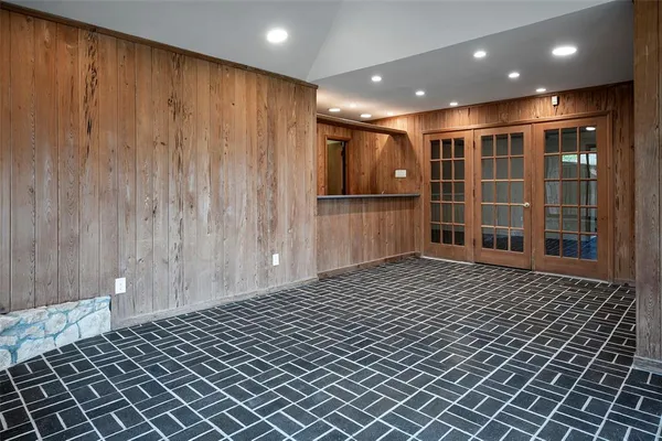 a kitchen with stainless steel appliances granite countertop a sink and cabinets