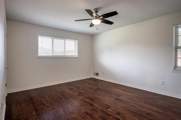 a bathroom with a double vanity sink toilet and shower