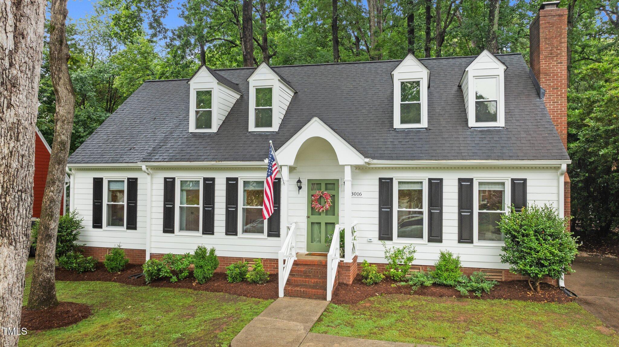 3016 Bolo Trail Raleigh, NC 27615 - Photo 1 of 28 a front view of a house with a garden and plants