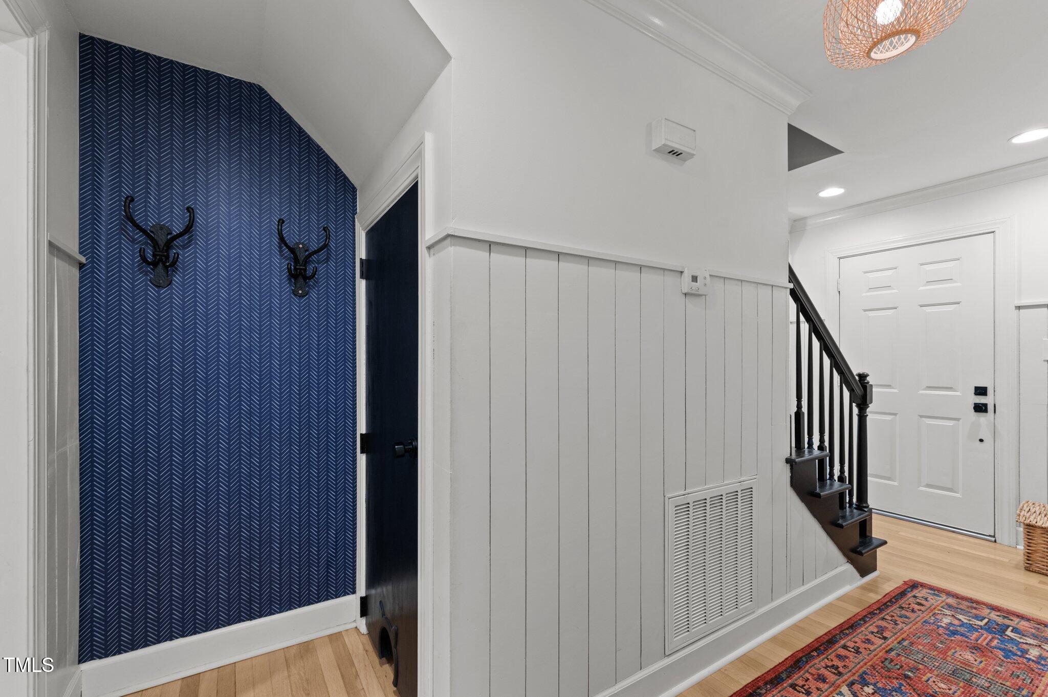 3016 Bolo Trail Raleigh, NC 27615 - Photo 12 of 28 a view of a hallway with wooden floor and entryway