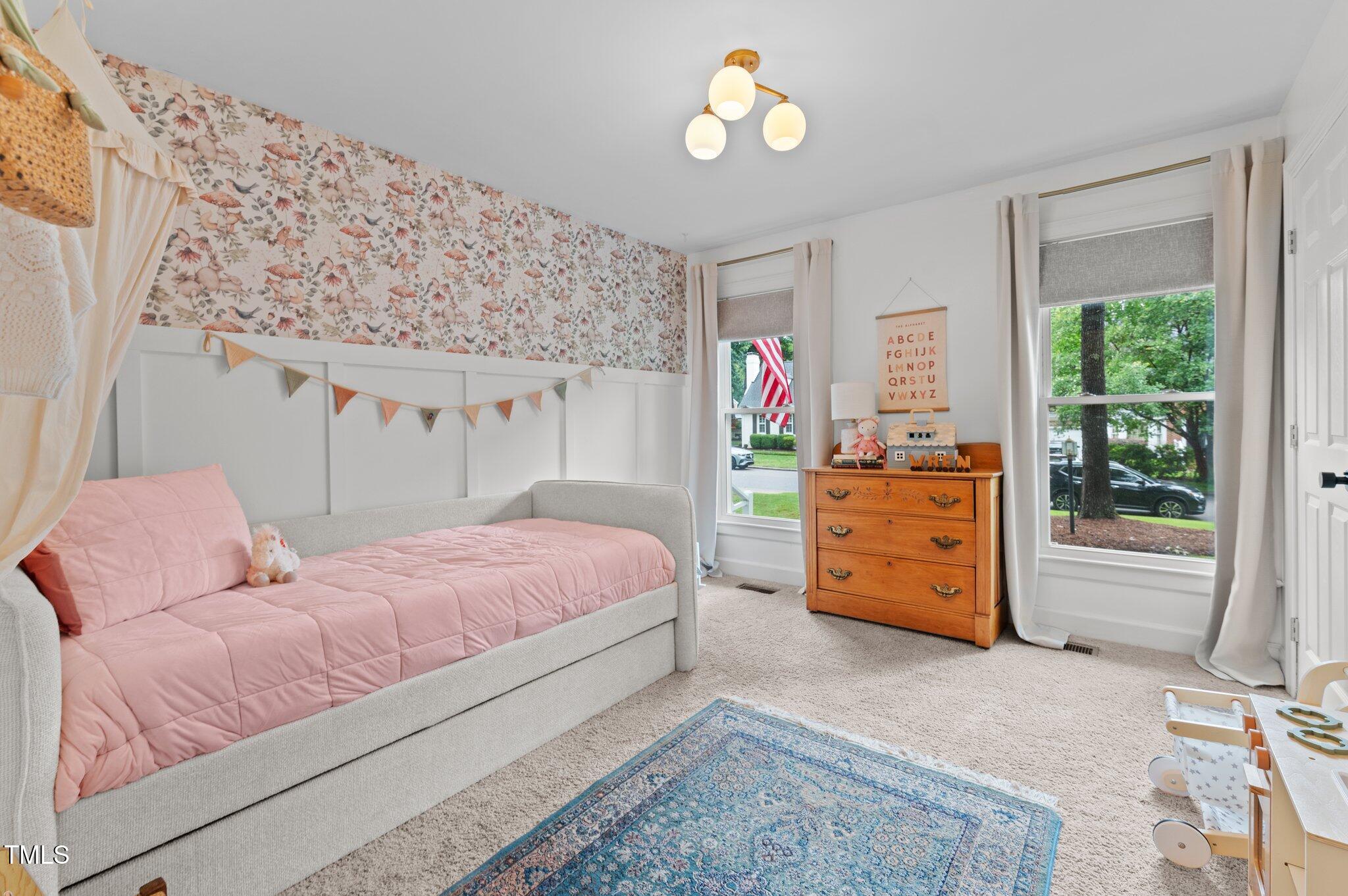 3016 Bolo Trail Raleigh, NC 27615 - Photo 14 of 28 a bedroom with a bed and a window
