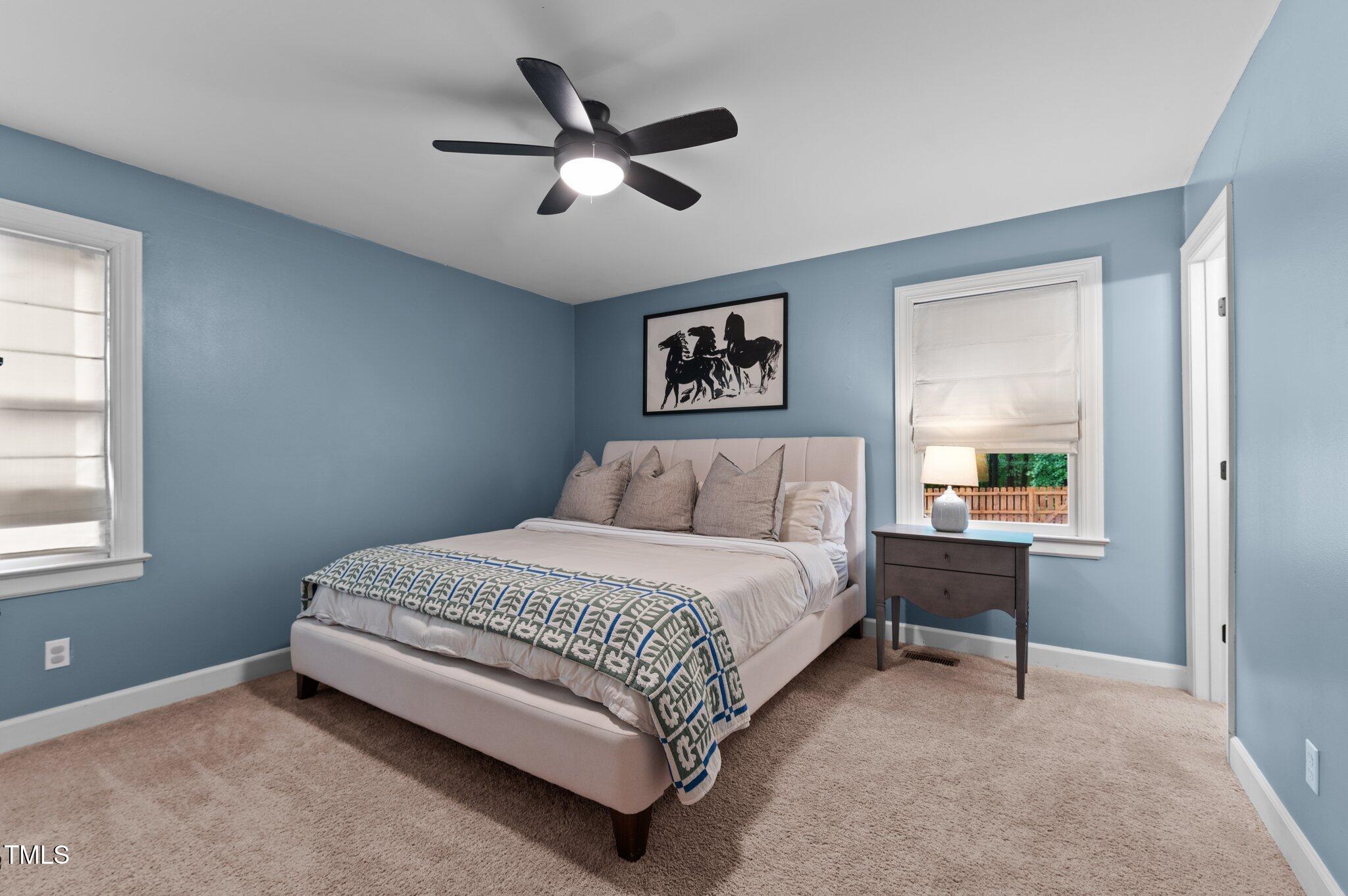 3016 Bolo Trail Raleigh, NC 27615 - Photo 15 of 28 a bed room with a bed and a window