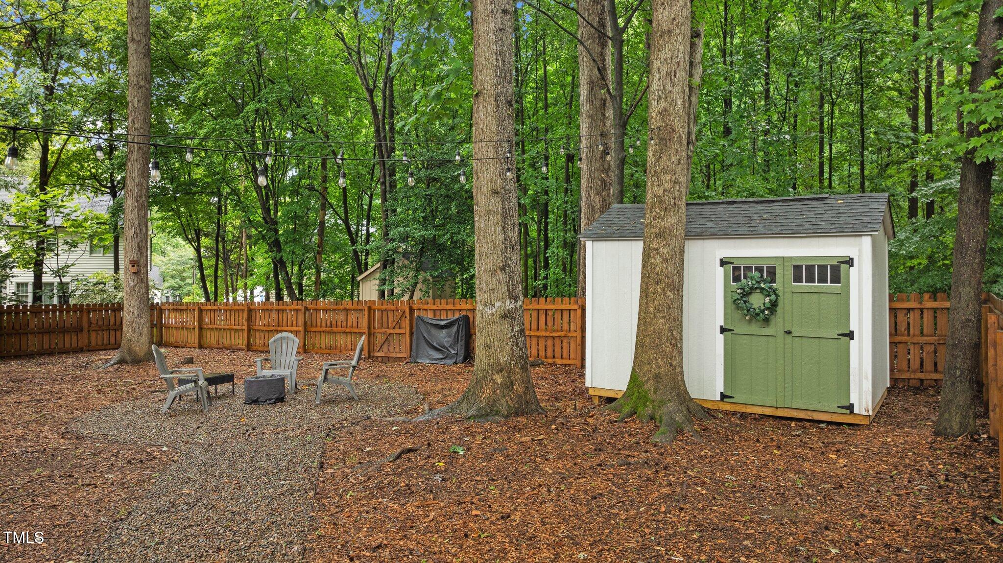 3016 Bolo Trail Raleigh, NC 27615 - Photo 20 of 28 a view of a backyard with a tree