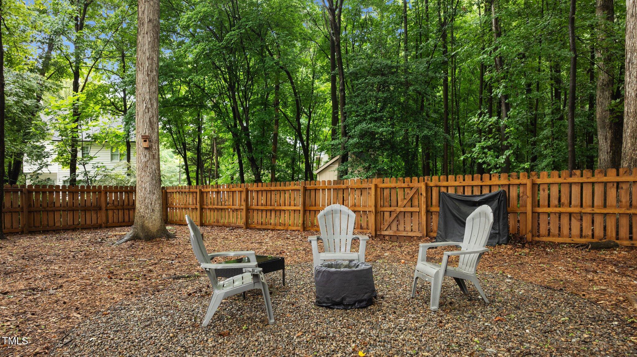 3016 Bolo Trail Raleigh, NC 27615 - Photo 21 of 28 a view of a chair and fire pit in backyard